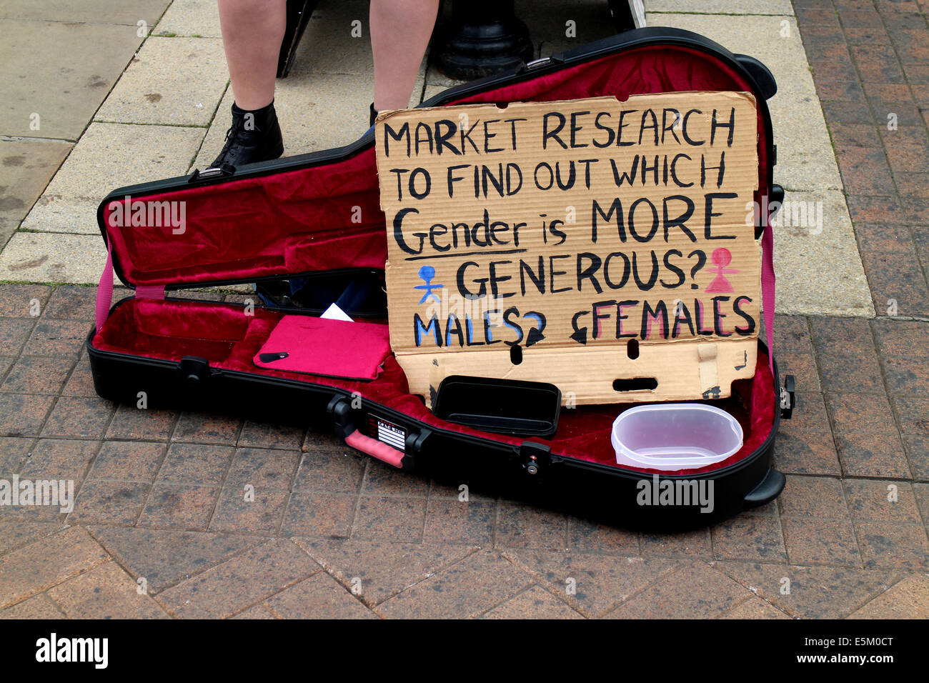 Busker`s guitar case with sign, Stratford-upon-Avon, UK Stock Photo